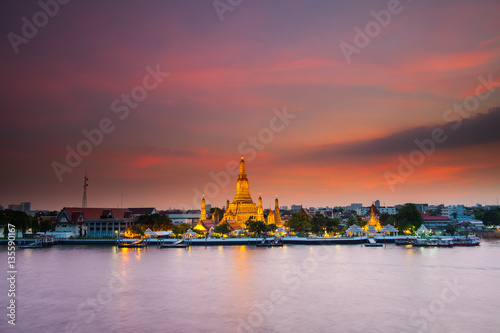 Reflection of gold pagoda "Wat Arun" temple of Bangkok at night time  © pattierstock