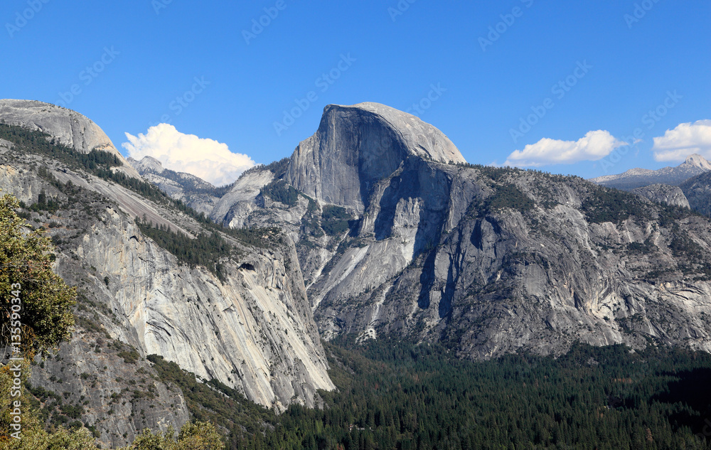 In view are North Dome, Half Dome, and Yosemite Valley. Photographed looking east from the Upper Yosemite Fall Trail, Yosemite National Park, California.
