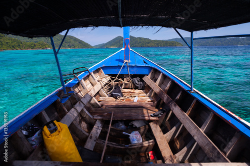 Boat and beach at ocean in Tropicana under clear sky located at south of thailand