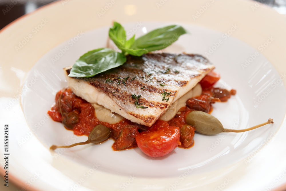 Sea bass fillet with tomato sauce and capers Sea bass fillet with tomato sauce and capers