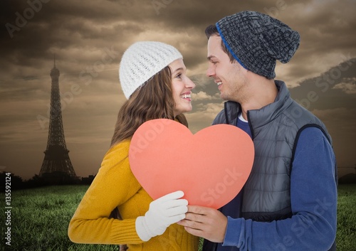 Romantic couple holding a heart photo