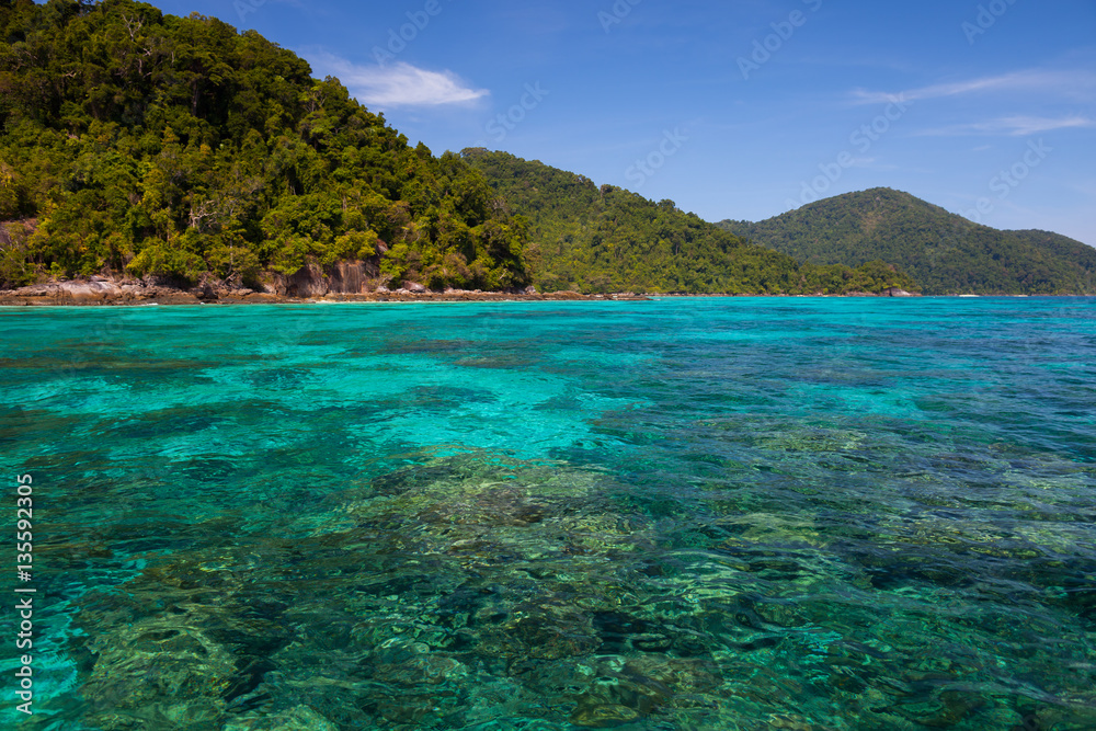 A clear water of ocean beside island in Tropicana under clear sky located south of thailand