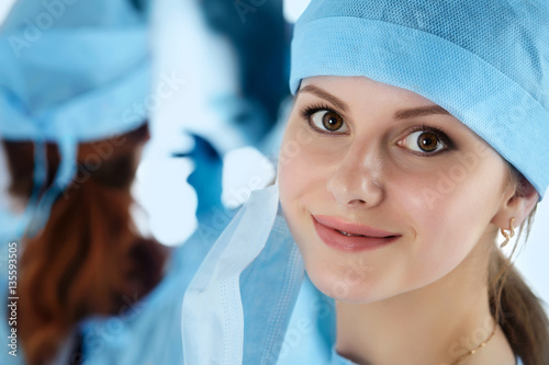 Close up portrait of young female surgeon doctor