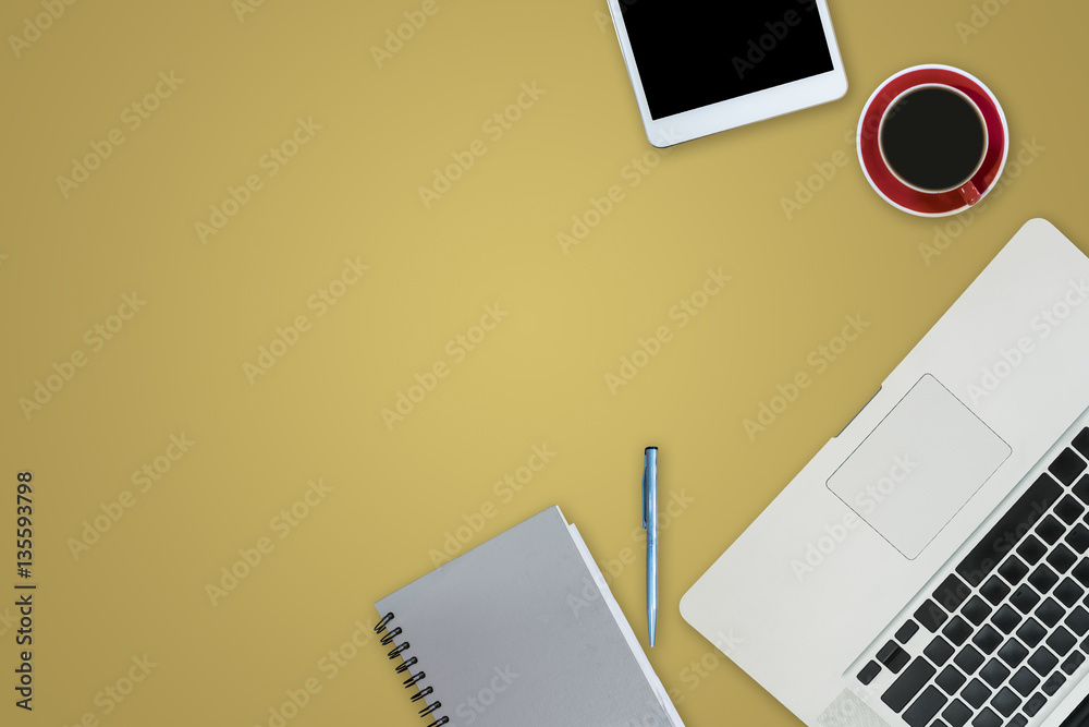 office equipment,laptop computer, smartphone with white screen over a notebook and cup of coffee. Top view on yellow background with copy space, flat lay. office equipment,laptop computer, smartphone with white screen over a notebook and cup of coffee. Top view on yellow background with copy space, flat lay.