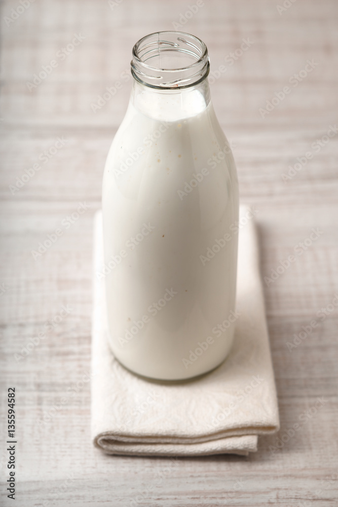 Kefir in a glass bottle on the table Kefir in a glass bottle on the table