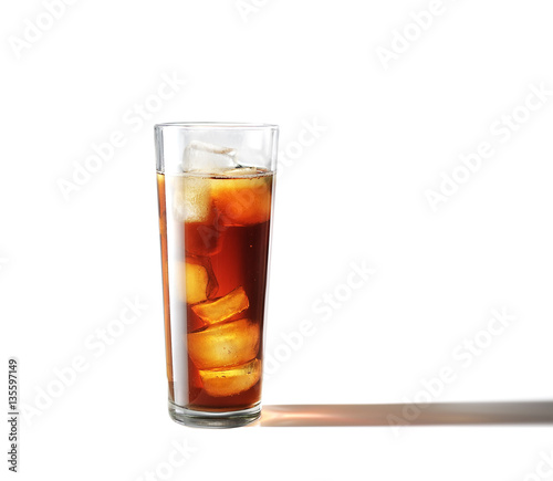 Cold glass of iced tea with ice cubes, isolated on white background with clipping path