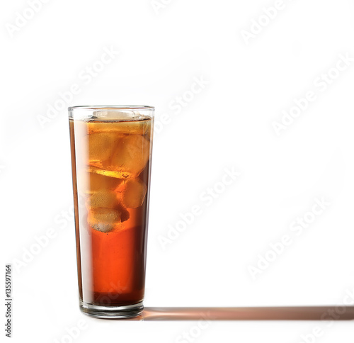 Cold glass of iced tea with ice cubes, isolated on white background with clipping path