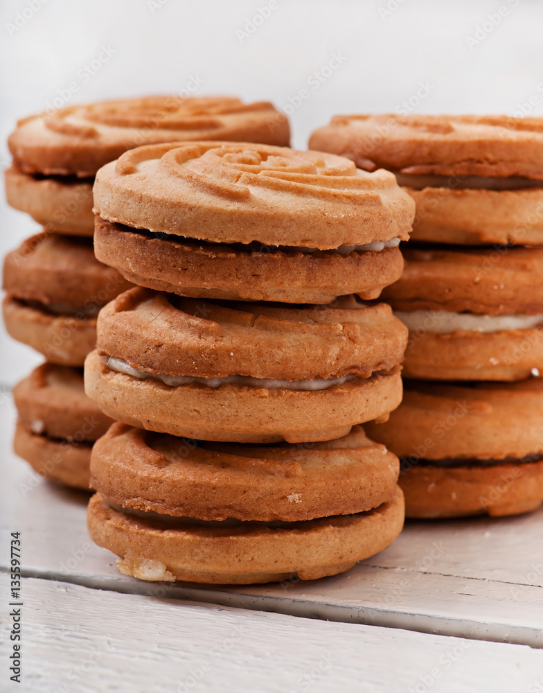 Tasty baked cookies on old wooden background. Tasty baked cookies on old wooden background.