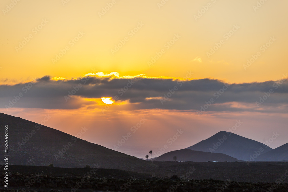 spectacular sunset over the volcanic mountains in Lanzarote