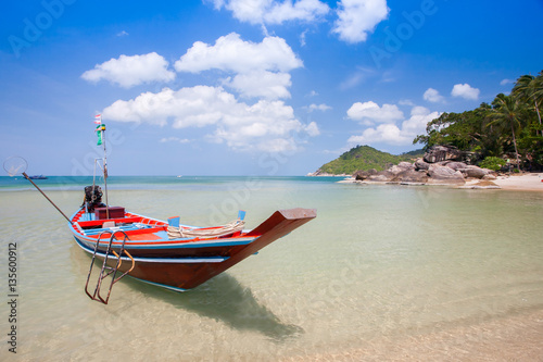 A wooden longboat on beach  © pattierstock
