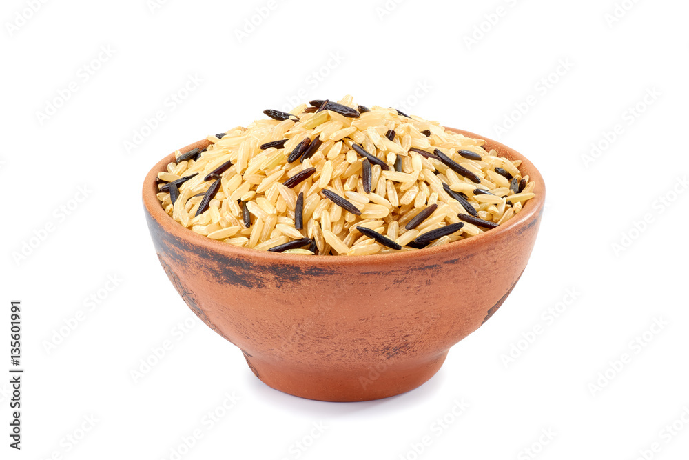 Brown and black rice in ceramic bowl on white Brown and black rice in ceramic bowl on white