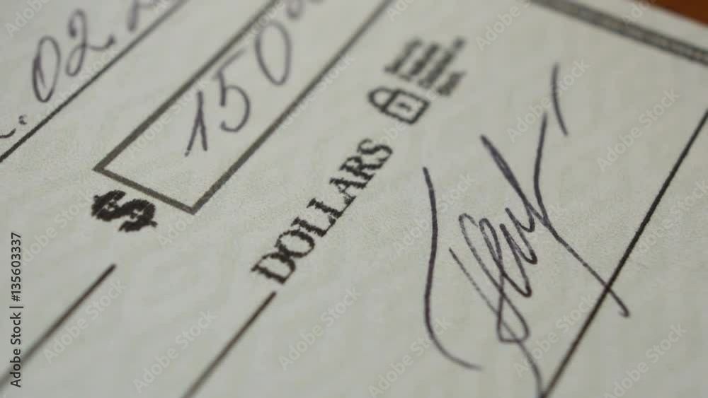 Writing a check for a cash amount. Check was designed by me, it is fake. The name signature etc are all fake.