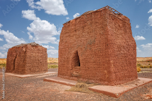 Chullpas or burial towers at Huanuni Cachu near River Desaguadero photo