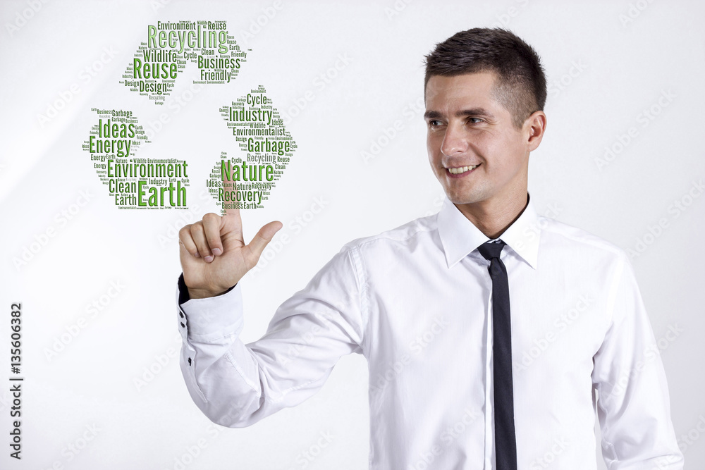 Recycling - Young businessman touching word cloud Recycling - Young businessman touching word cloud