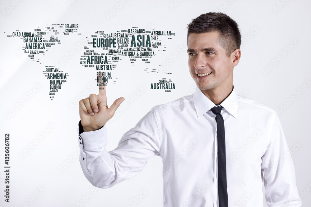 World map with country names - Young businessman touching word c World map with country names - Young businessman touching word c
