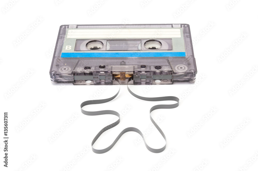Audio cassette with unwound tape closeup on white background Audio cassette with unwound tape closeup on white background