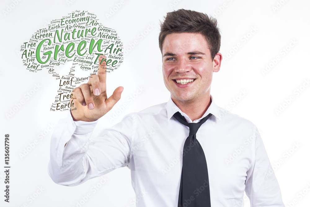 Green Tree - Young businessman touching word cloud Green Tree - Young businessman touching word cloud
