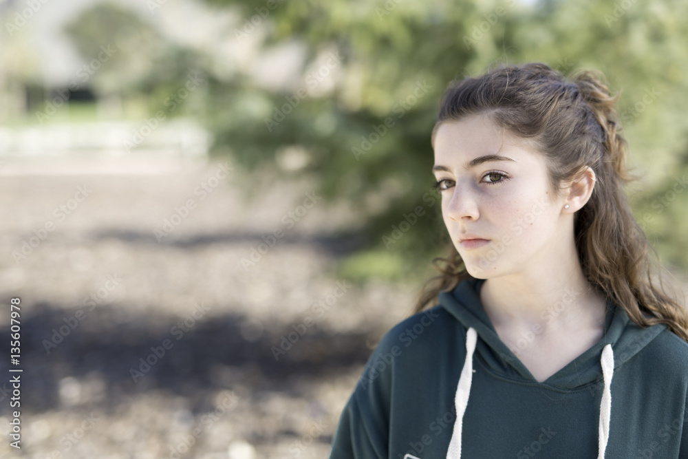 Portrait of a young girl in a park.