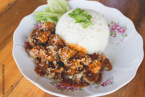 Close up thai sweet braised pork with sesame ราดข้าว.