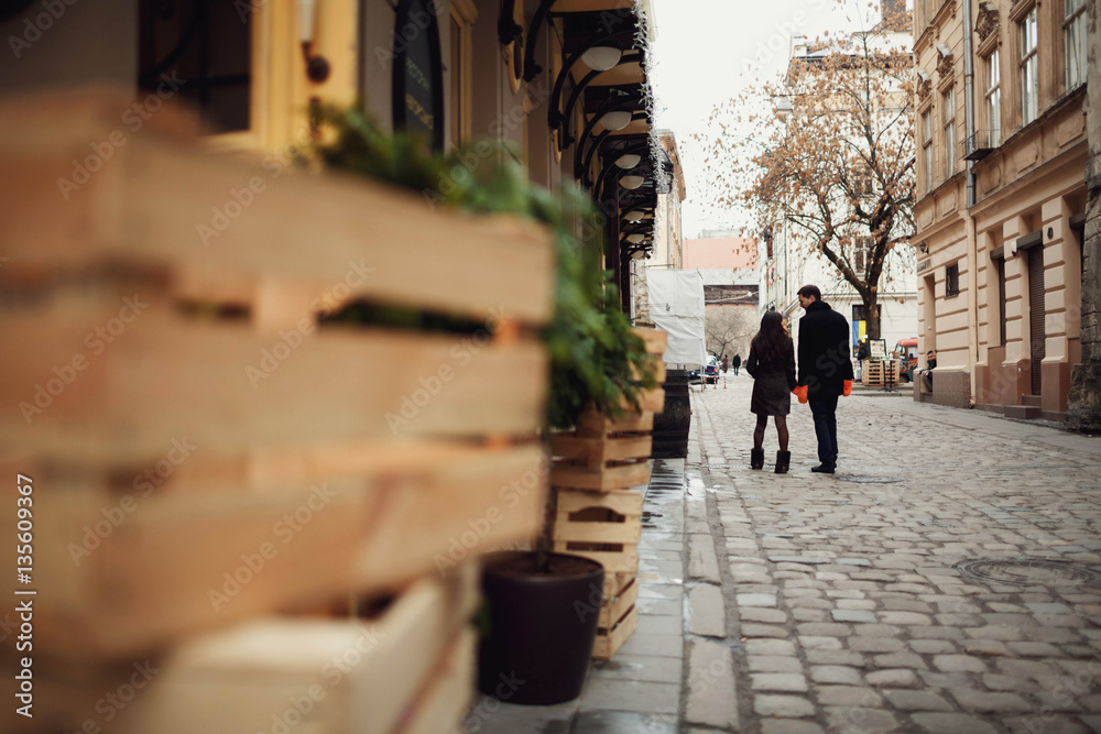 man and woman walks and holding hands in mittens outdoors man and woman walks and holding hands in mittens outdoors