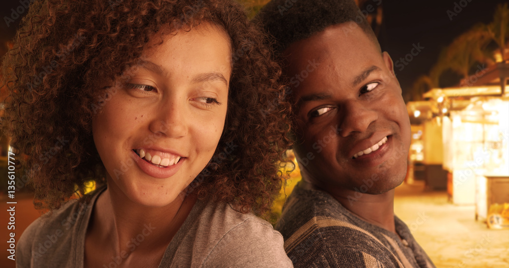 Black man and woman lean on each other on the streets Black man and woman lean on each other on the streets