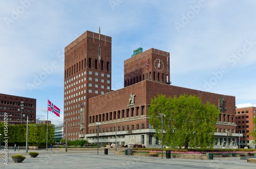 Oslo City Hall with Norwegian flags. Springtime.