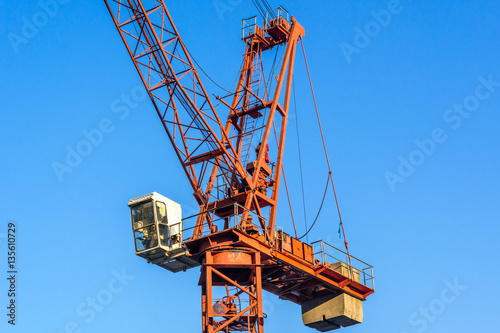 The crane against modern buildings under construction.