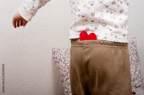 Small heart in the trousers of pajamas of kid