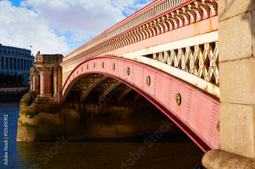 London Blackfriars bridge in Thames river photo