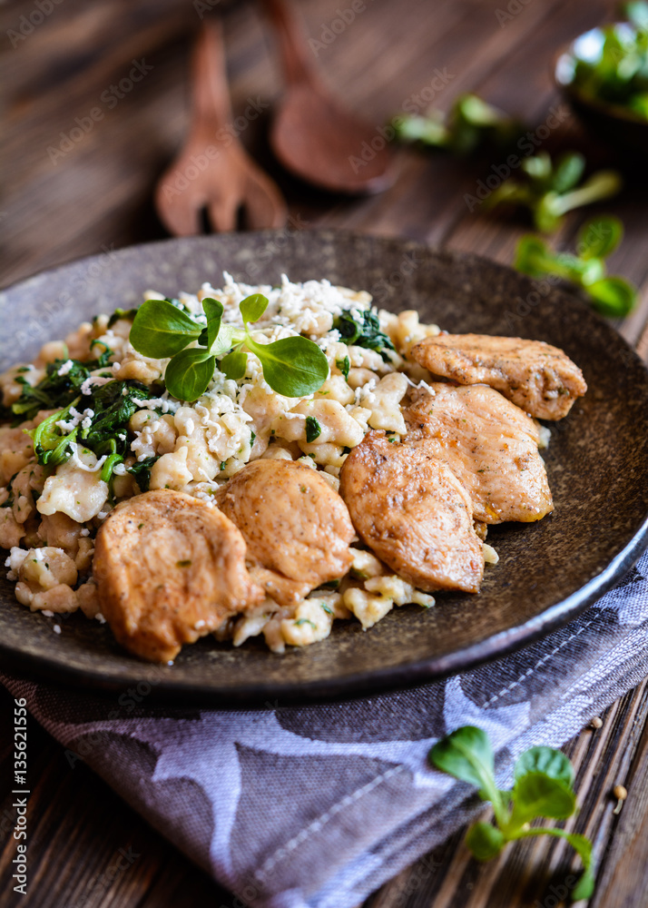 Fried chicken meat with spelt flour dumplings and spinach Fried chicken meat with spelt flour dumplings and spinach