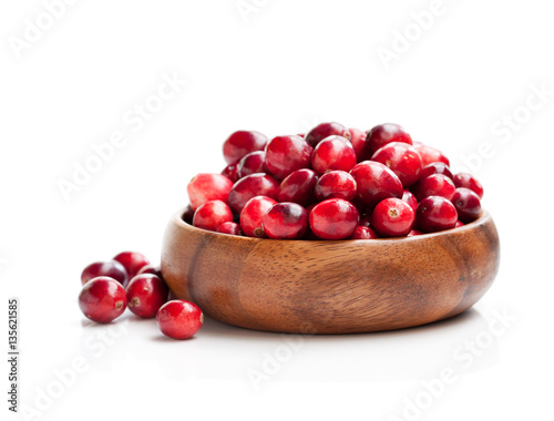 Fresh  cranberries in wooden bowl isolated on white background