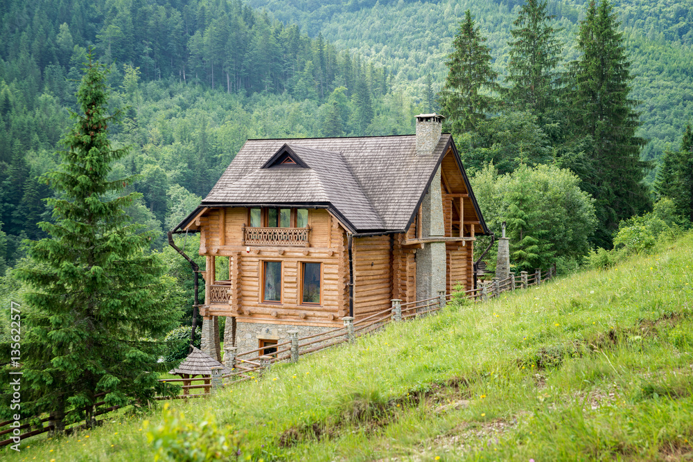 Lonely wooden house in the Carpathian mountains Lonely wooden house in the Carpathian mountains