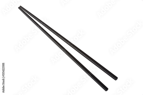 Black chopsticks isolated on white background photo