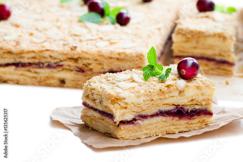 Napoleon  cake with cranberry and mint on white background
