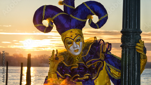Colorful mask and costume on sunrise from the venice carnival, Venice, Italy