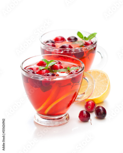 Red fruit tea with lemon and cranberry isolated on white backgr