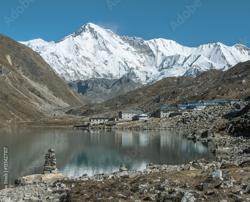 The view from the shores of the third lake in the village Gokyo and one of the highest peaks of the world Cho Oyu (8201 m) - Nepal, Himalayas photo