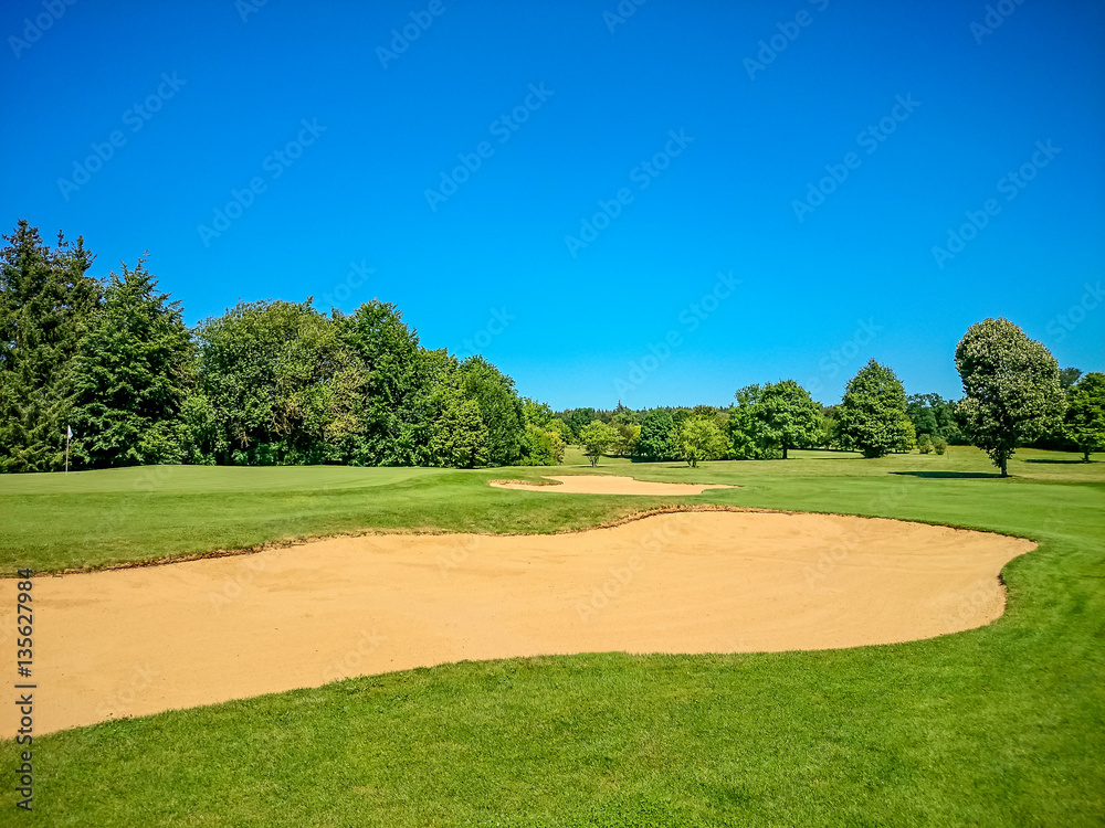 Golf course, natural green meadow, blue sky Golf course, natural green meadow, blue sky
