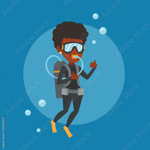 Woman diving with scuba and showing thumb up.