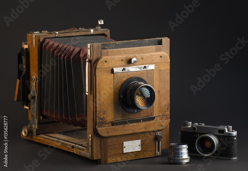 Old photographic camera on a dark gray background 2