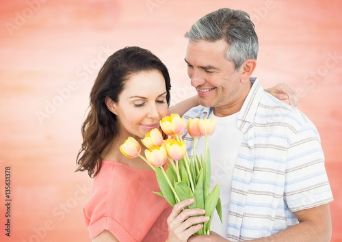Romantic couple smelling roses