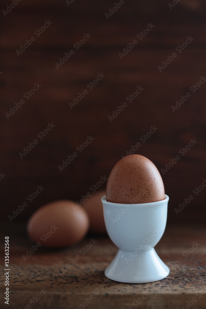 Boiled egg in a white eggcup