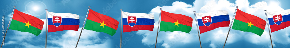 Burkina Faso flag with Slovakia flag, 3D rendering Burkina Faso flag with Slovakia flag, 3D rendering
