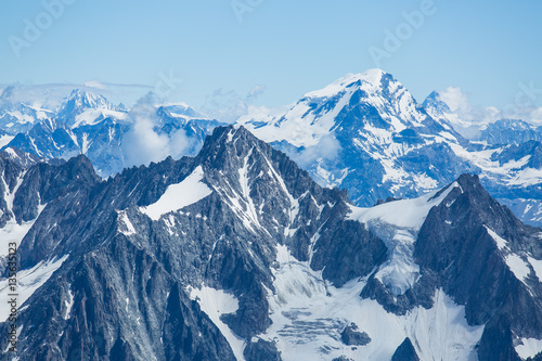 Ice  snow  and glaciers cling to the sides of Mont Blanc in the french Alps