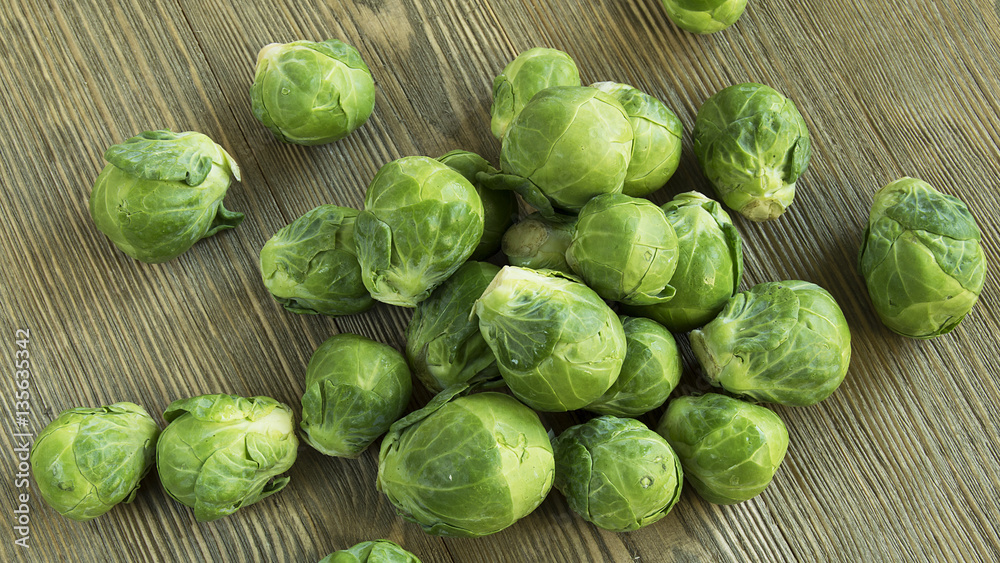 Brussel sprouts on wood table Brussel sprouts on wood table