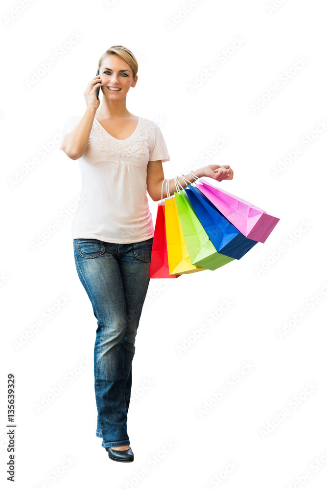 Woman Using Cellphone While Carrying Shopping Bag Woman Using Cellphone While Carrying Shopping Bag
