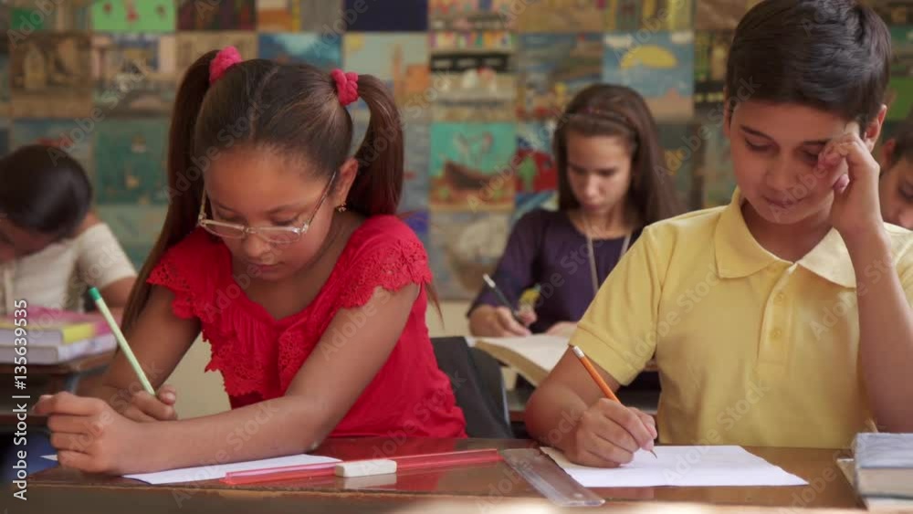 Young people and education. Group of hispanic students in class at school during lesson. Boys and girls cheating during admission test, examination