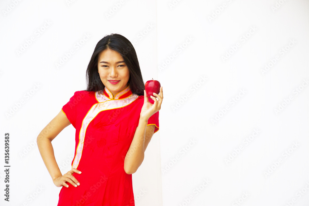 Asian woman smiling face is holding an apple. Asian woman smiling face is holding an apple.
