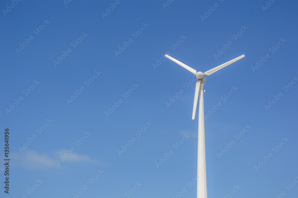 Wind turbine or windmill generating electricity on blue sky back Wind turbine or windmill generating electricity on blue sky back