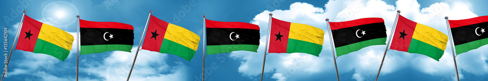 Guinea bissau flag with Libya flag, 3D rendering Guinea bissau flag with Libya flag, 3D rendering